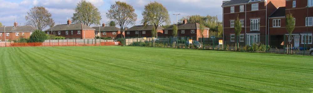 A new construction school at Banbury, Oxfordshire. The recently seeded  playing field following first cut of the new playing surface.
